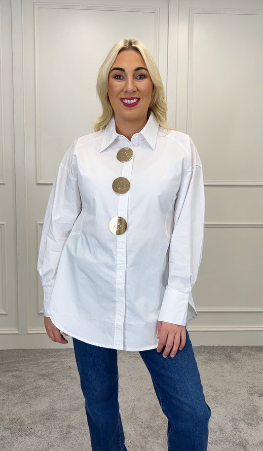 White shirt large gold buttons